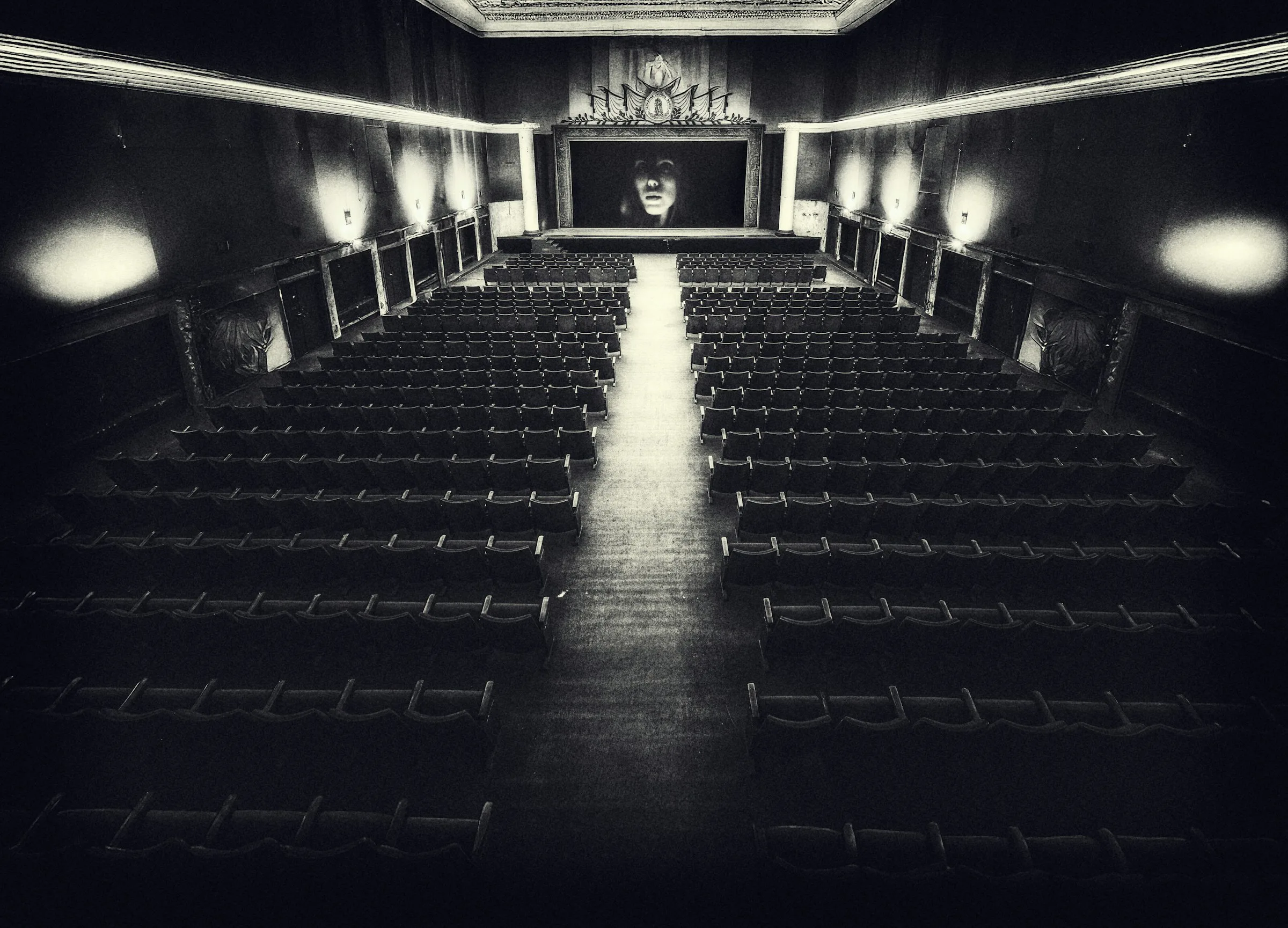 Empty vintage cinema hall with rows of seats facing the screen